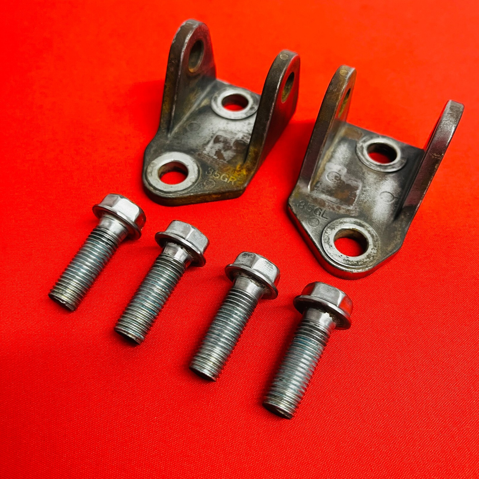 RMZ450 FOOT PEG MOUNTS BRACKETS BOLTS GENUINE OEM SUZUKI RMZ 450 2005-2007