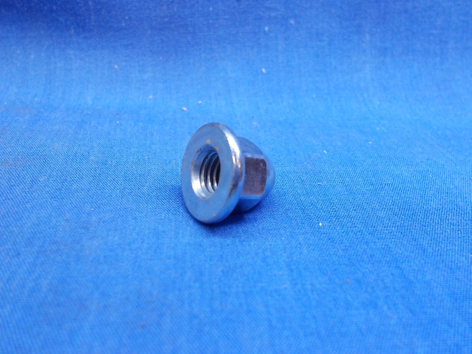 Honda 90443-107-000. OEM Cap Nut. 8mm-1.25. Fits Multiple Honda Applications.