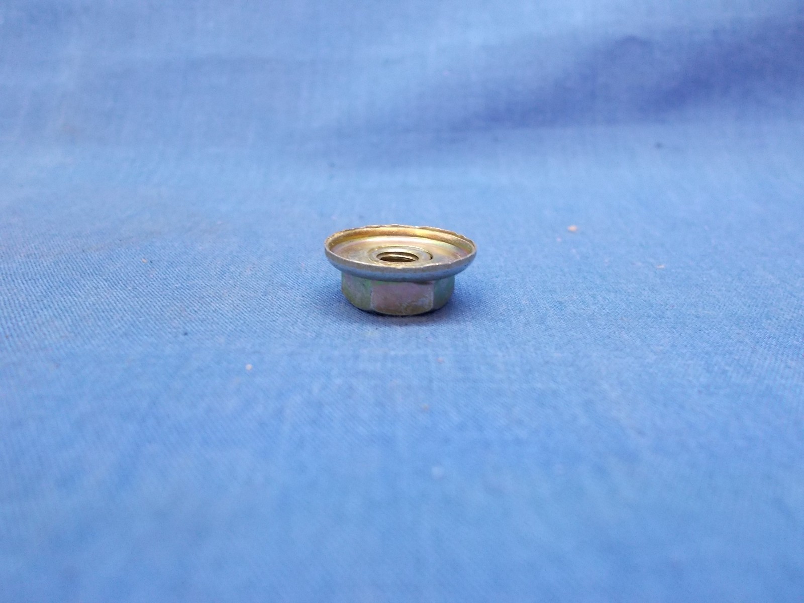 Kawasaki 23020-023. OEM 5mm Nut. Fits Multiple Kawasaki Applications.