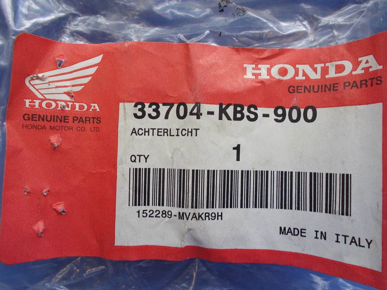 Honda 33704-KBS-900. OEM Tail Light Ornament. Fits Honda SFX50 SFX50MM.