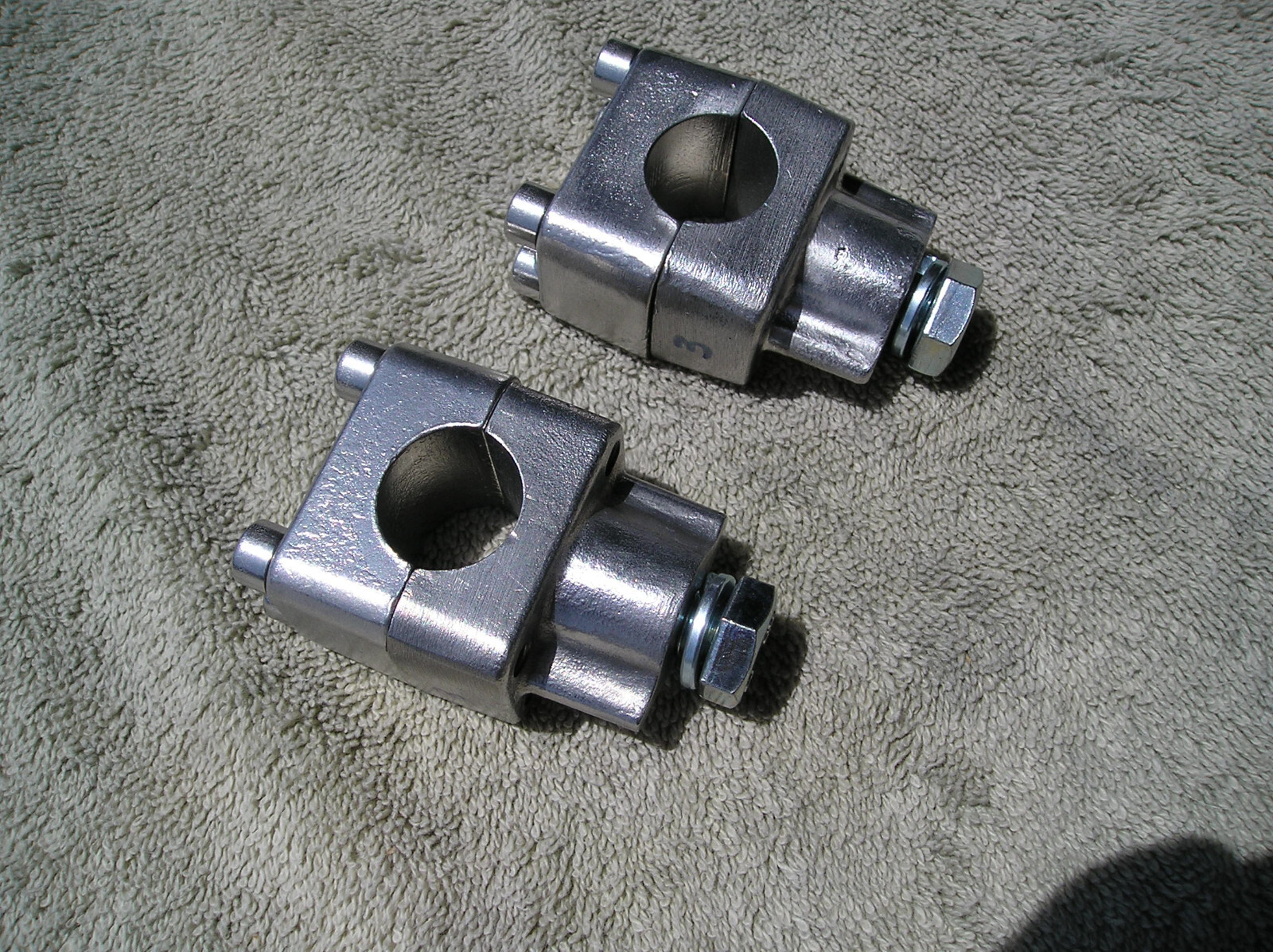 Husqvarna Handlebar Clamps fits 7/8″ bars; 125 thru 500, 1967-1976 (2 pair)