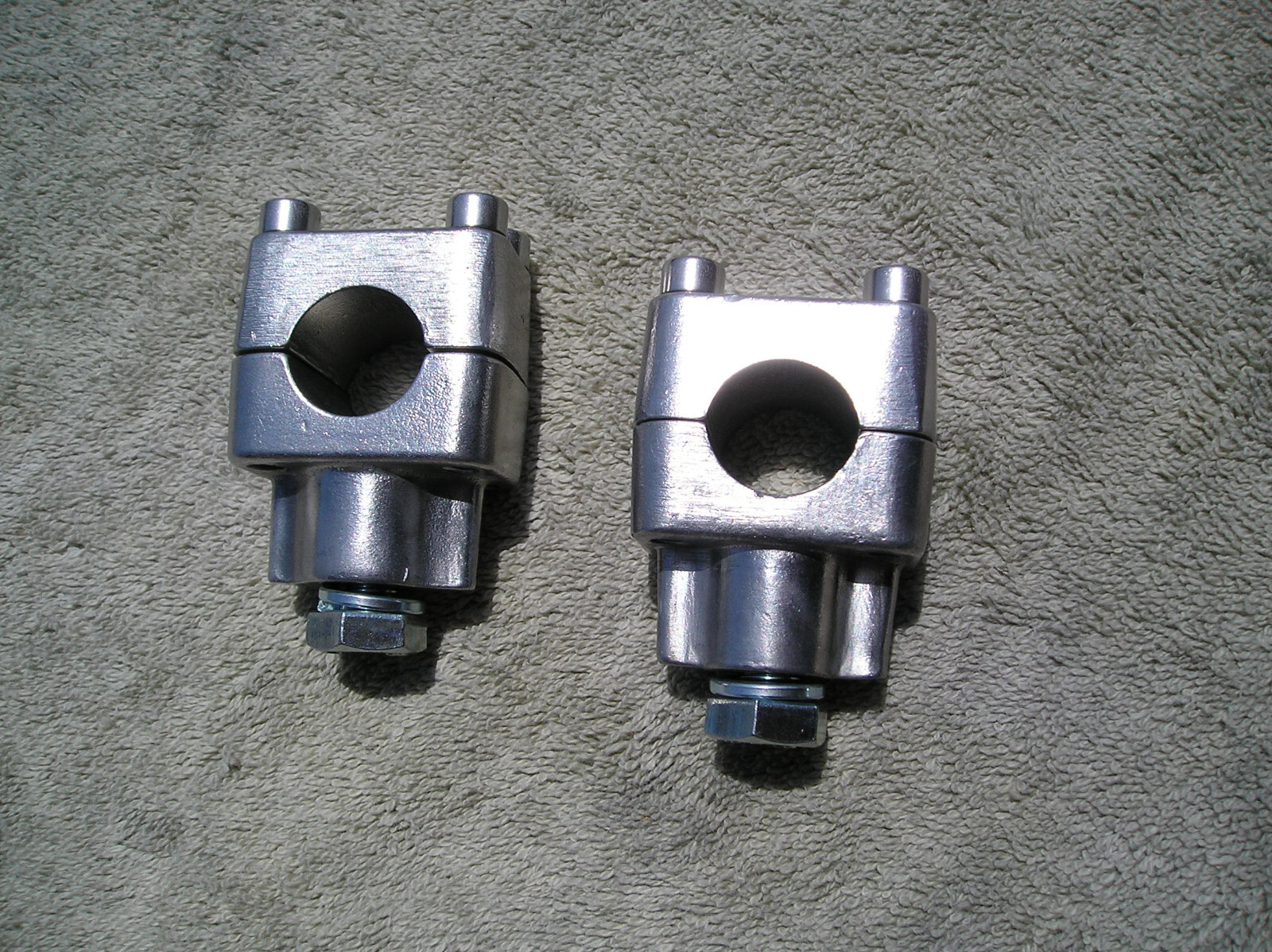 Husqvarna Handlebar Clamps fits 7/8″ bars; 125 thru 500, 1967-1976 (2 pair)