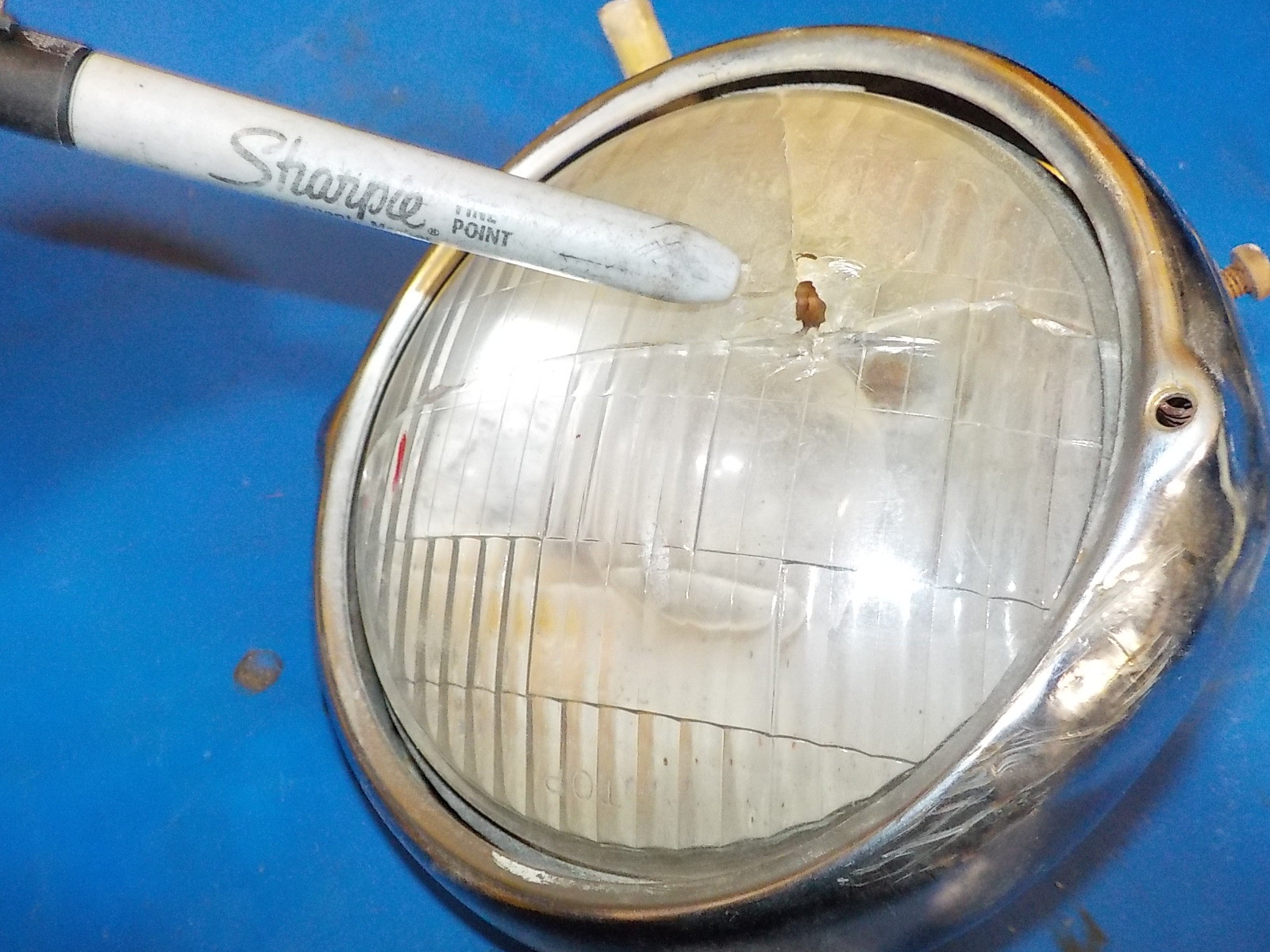 HONDA XL 125 1974 HEADLIGHT / BEZEL DAMAGE AS SHOWN IN PICTURES , USED