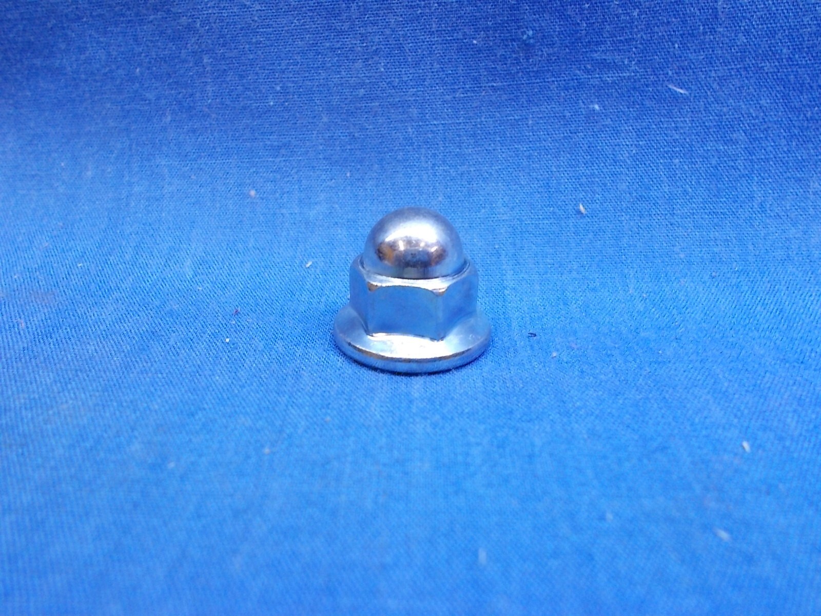 Honda 90443-107-000. OEM Cap Nut. 8mm-1.25. Fits Multiple Honda Applications.