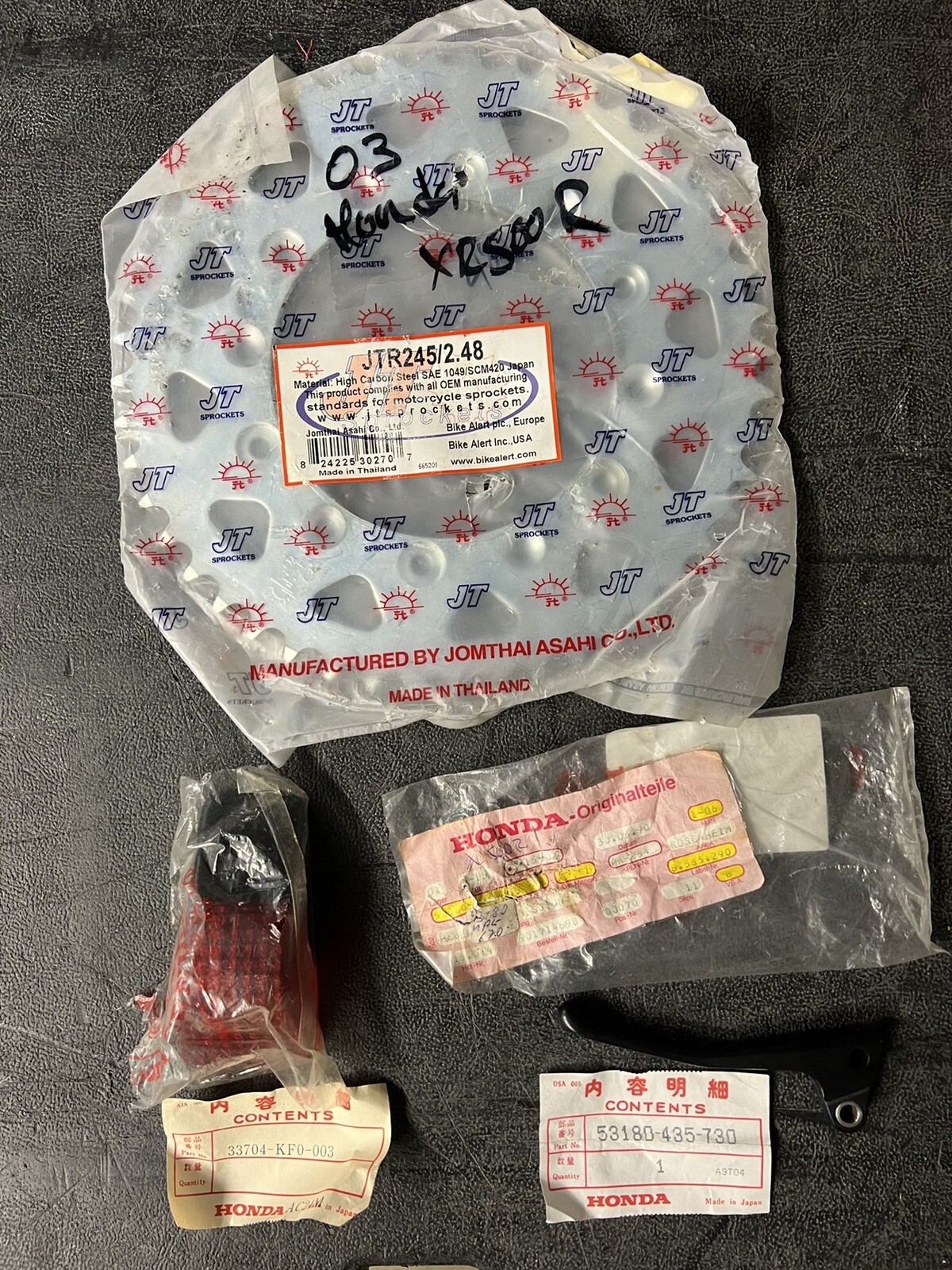 83-84 Honda XR500 Taillight lens and Decompression Lever Nos 33704-KF0-003