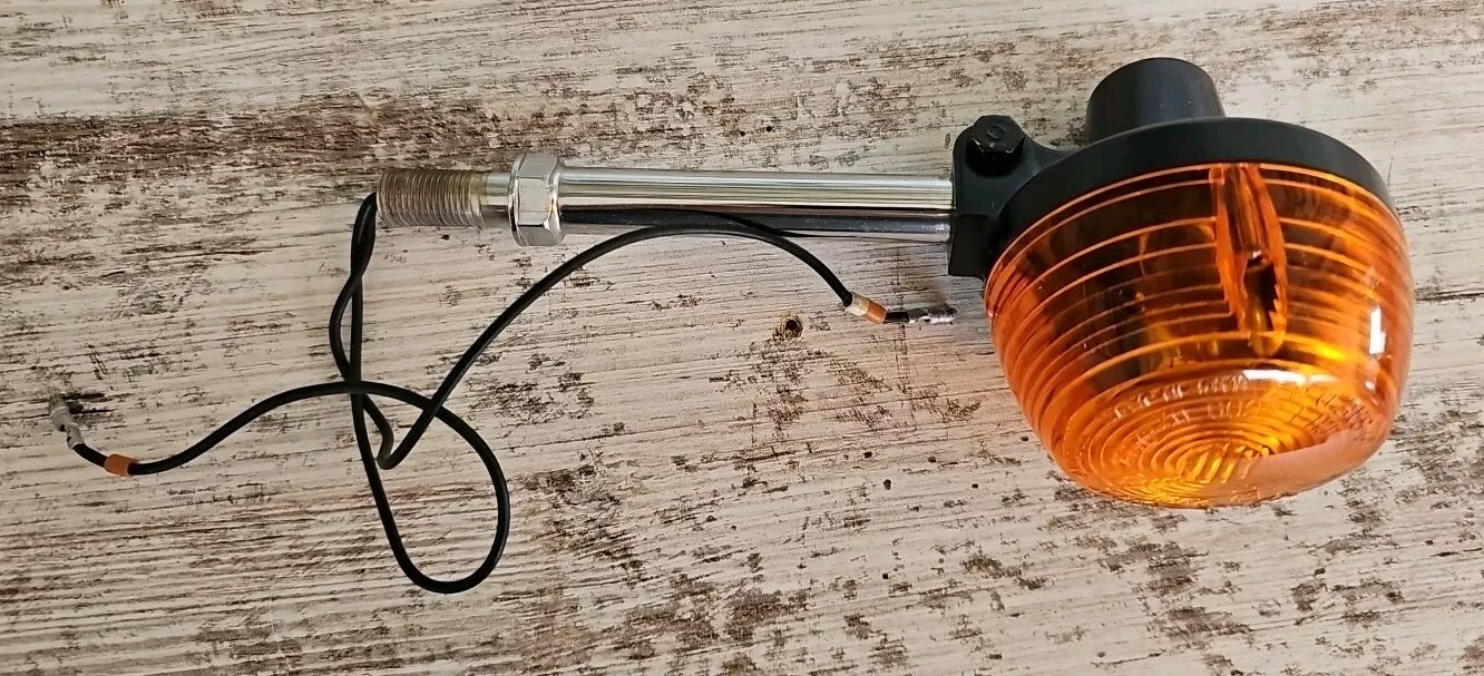 Vintage metal and plastic 3″ lens front motorcycle signal light, orange